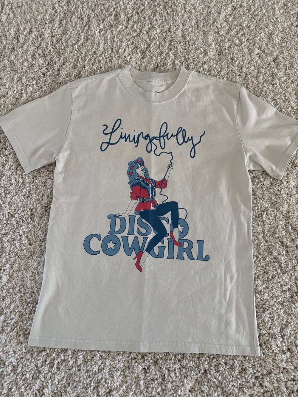 Living Fully Cream Disco Cowgirl' Graphic Tee with Navy & Red Print.